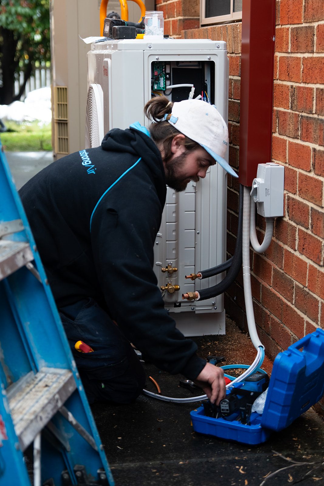Technician servicing a split system